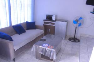 a living room with a couch and a table at Exodus Guesthouse Mahlakwena Stee'lpoort in Steelpoort