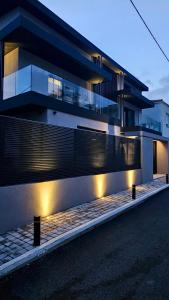 a building with lights on the side of it at Kalvokoresi 16 I Premium Apartments in Chios