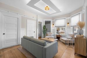 a living room with a couch and a table at Blatchley Rooms by Yale in New Haven +47 photos