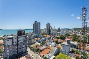 an aerial view of a city with buildings and the ocean at Apt w/ BBQ and Partial Ocean View ALE0803 in Piçarras