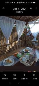 a page of a website with a table with food at Villareal Homestay in Coron