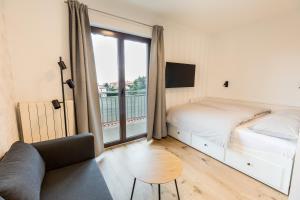 a bedroom with a bed and a large window at Apartments Dorijan with Pool in Matulji +38 photos