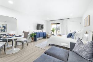a bedroom with a bed and a living room at Golf Coast Bleu III - 3158-3160 in Zephyrhills