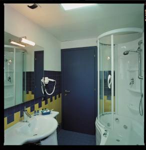 a bathroom with a shower and a sink and a toilet at Hotel & Loisir Le Ruote in Roveleto +48 photos