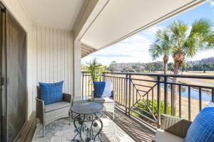 a balcony with a table and chairs and a view of the water at Golf Coast Bleu II - 3158 in Zephyrhills