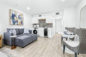a living room with a couch and a table at Golf Coast Bleu Studio - 3160 in Zephyrhills