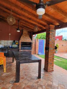 a patio with a table and a brick oven at Casita de Natalia in San Bernardino