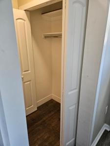 a closet with white walls and a door at Apartment in Cleveland in Cleveland