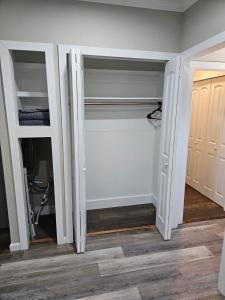 a walk in closet with white doors in a room at Apartment in Cleveland in Cleveland