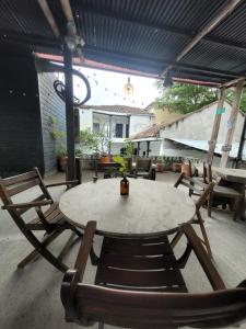 a table and chairs sitting on a patio at Hotel Capilla del sol in Garzón
