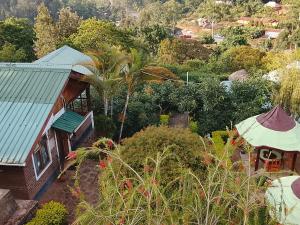 an aerial view of a house with a roof at Avocado Lodge in Lushoto