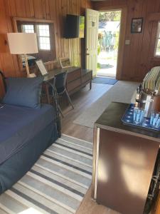 a living room with a couch and a table at Cape Cod Motor Inn in South Yarmouth