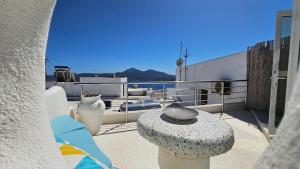 a group of white vases sitting on a balcony at Plaka View Nest in Plaka Milou
