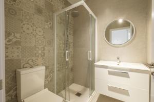 a bathroom with a shower and a toilet and a sink at Comfortable Room close to City Centre in Valencia