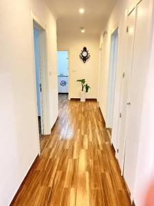 an empty hallway with wooden floors in an apartment at Guest house in Addis Ababa
