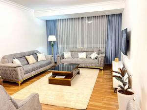 a living room with two couches and a coffee table at Guest house in Addis Ababa