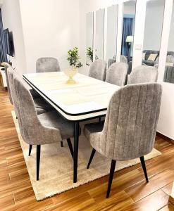 a dining room table and chairs in a room at Guest house in Addis Ababa