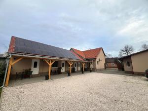 a building with a lot of solar panels on it at Napfény Apartman in Makó