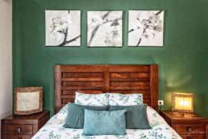 a bedroom with a bed with four pictures on the wall at casa moni 2 in El Paso +52 photos