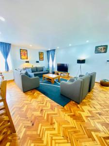 a large living room with couches and a table at Guest house in Addis Ababa