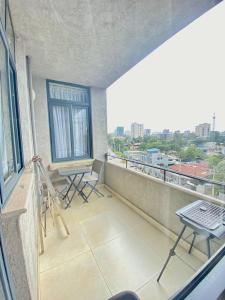 a balcony with a painting and a easel on it at Guest house in Addis Ababa