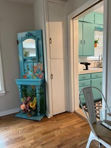 a bathroom with a fish tank next to a mirror at Three Queens Entire House 3 Beds in Amarillo +35 photos
