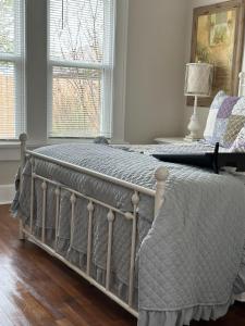 a bed sitting in a room with a window at Three Queens Entire House 3 Beds in Amarillo