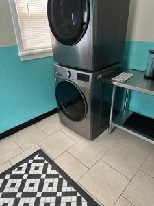 a washer and dryer in a kitchen with a counter at Three Queens Entire House 3 Beds in Amarillo