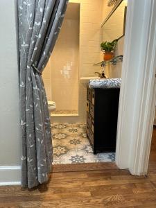 a bathroom with a shower and a sink at Three Queens Entire House 3 Beds in Amarillo