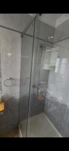 a shower with a glass door and a sink at CHALET LOS PEPES in El Palmar +9 photos