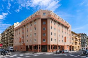 a large building on the corner of a street at easyHotel Nice Old Town in Nice