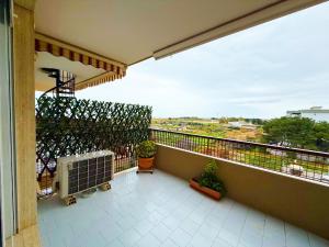 a balcony with plants and a heater on it at Vista Mare 22 Due Camere triple o doppie in Bari