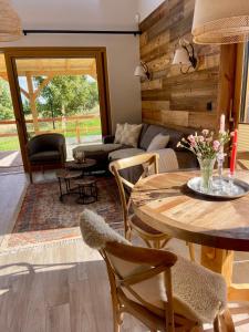 a living room with a table and a couch at Izera House in Świeradów-Zdrój +59 photos