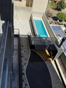 an overhead view of a house with a swimming pool at Estudio 63 in Neuquén