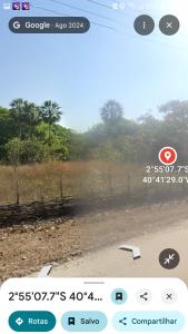 a view of a field from a train window at Camping da silmara g in Camocim