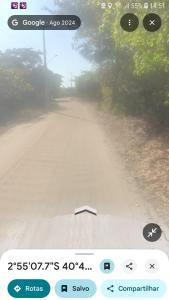 a picture of a dirt road from a bus at Camping da silmara g in Camocim