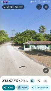 a screenshot of a cell phone of a road with a house at Camping da silmara g in Camocim