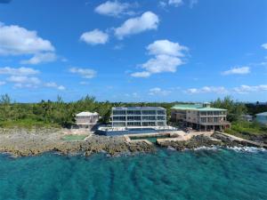 an aerial view of a resort and the water at Lighthouse Point Residences in West Bay