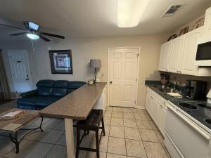a kitchen with a couch and a table in a room at Rivers Edge 803 in Helen +4 photos