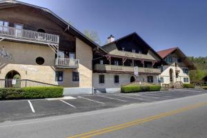 an empty parking lot in front of a building at Rivers Edge 803 in Helen