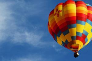a colorful hot air balloon flying in the sky at Bavarian Brook 7A in Helen