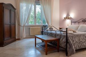 Llit o llits en una habitació de Aedes B&B Il Giardino dei Sogni