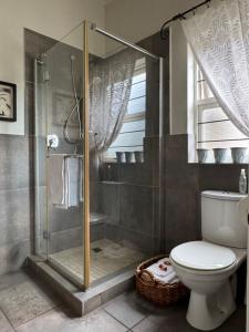 a bathroom with a shower and a toilet at BLessing at Lynnwood in Pretoria +30 photos
