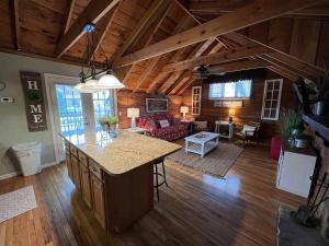 an open kitchen and living room in a log cabin at Bavarian Brook Condo 12 in Helen