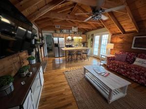 a living room with a couch and a table at Bavarian Brook Condo 12 in Helen