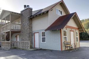 a building with a porch and a balcony at Bavarian Brook Condo 10 in Helen