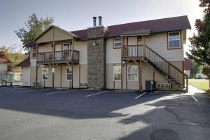 a building with a parking lot in front of it at Bavarian Brook Condo 16 in Helen