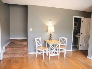 a dining room with a table and two chairs at Rivers Edge Condo 101 in Helen