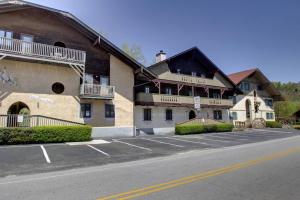 an empty parking lot in front of a building at Rivers Edge 504 in Helen