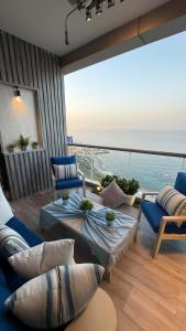 a living room with a view of the ocean at برج داماك الجوهرة جدة - Damac al jawharah tower in Jeddah